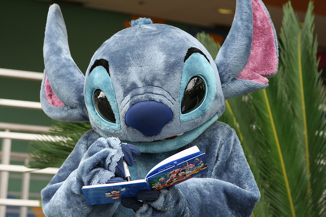 Stitch signing an autograph