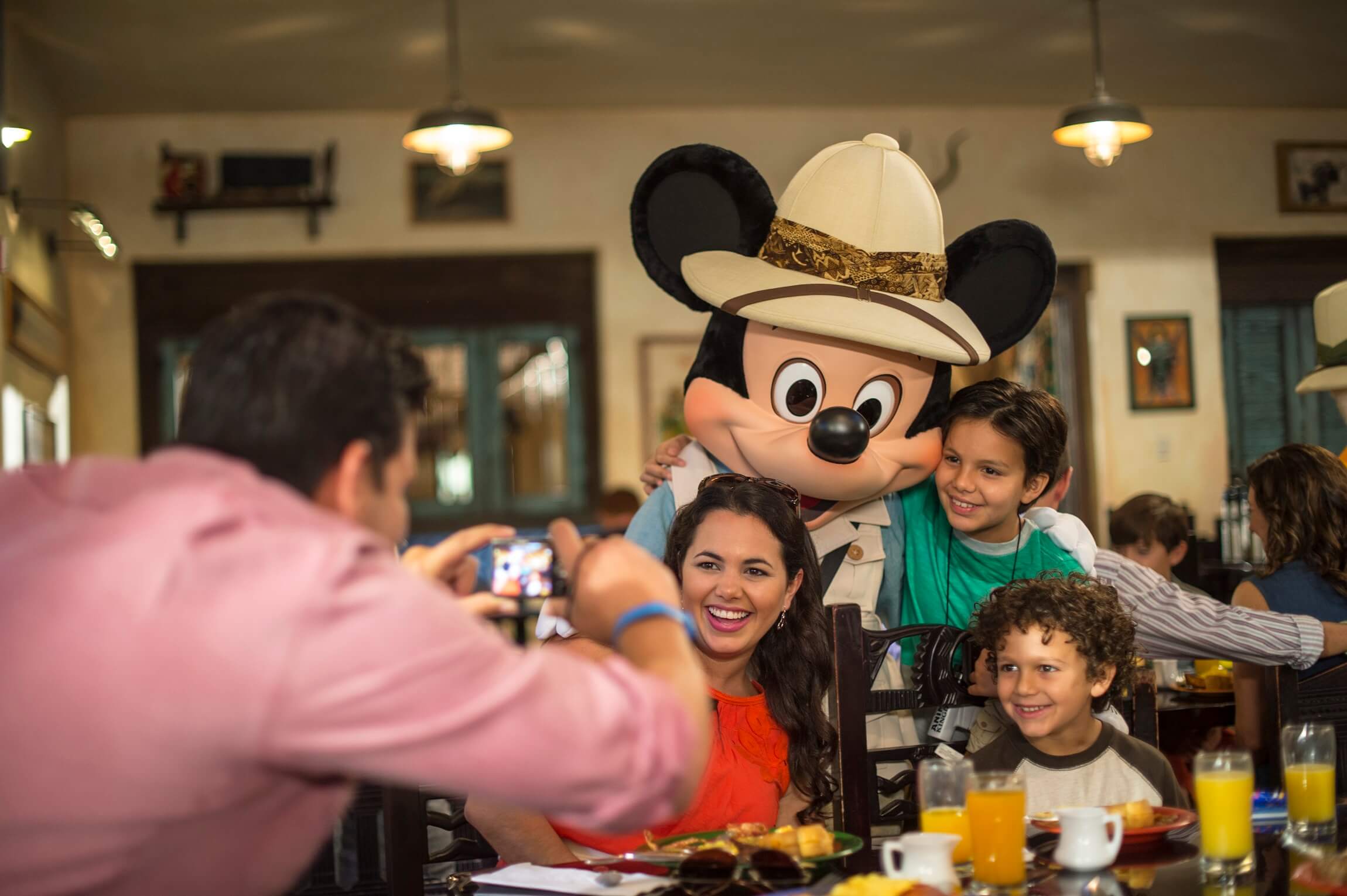 Family being photographed with Mickey at Tusker House