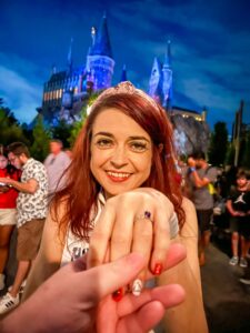 Engaged couple in front of Hogwarts Castle